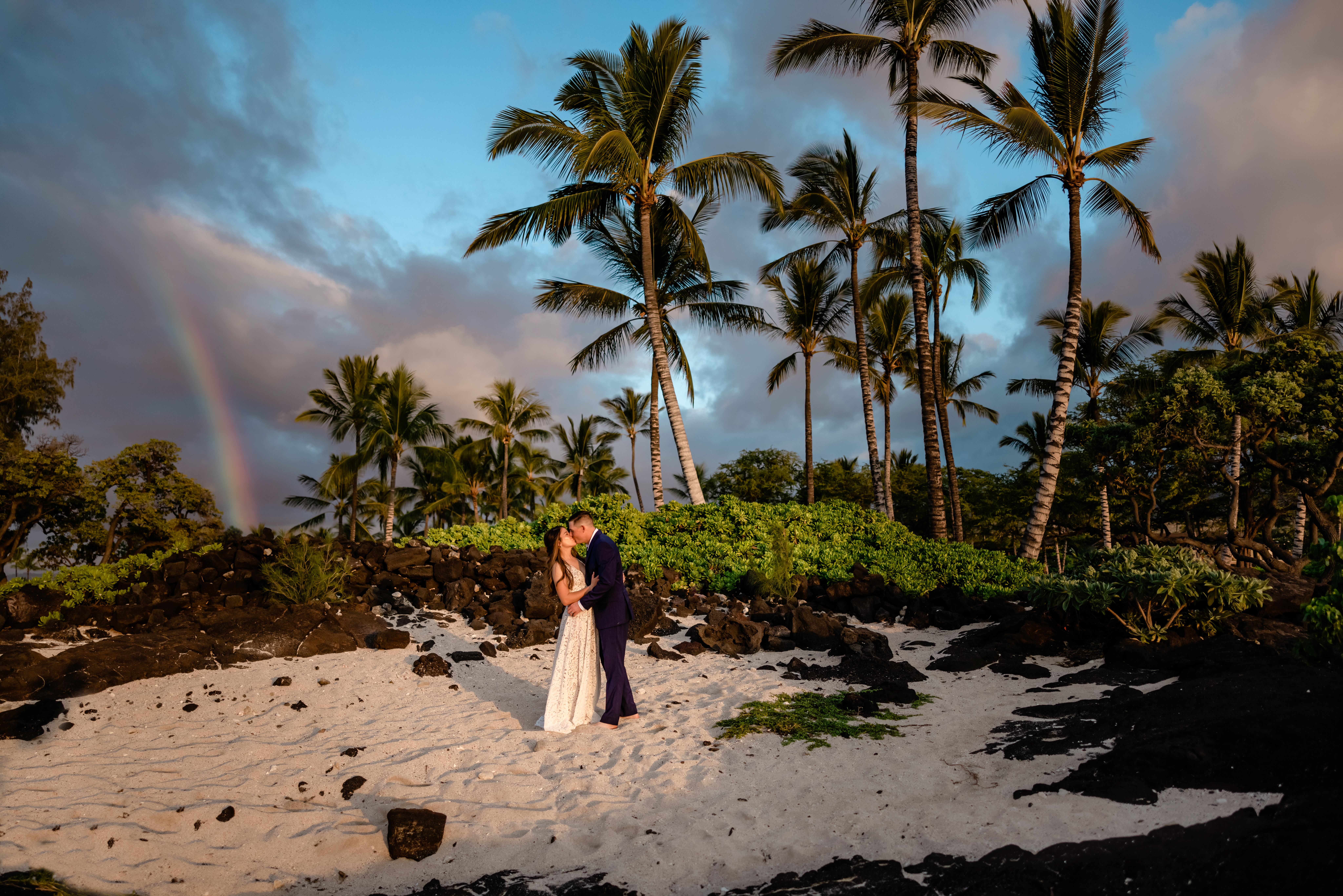 Rainbow behind newlywed couple on the Big Island of Hawaii