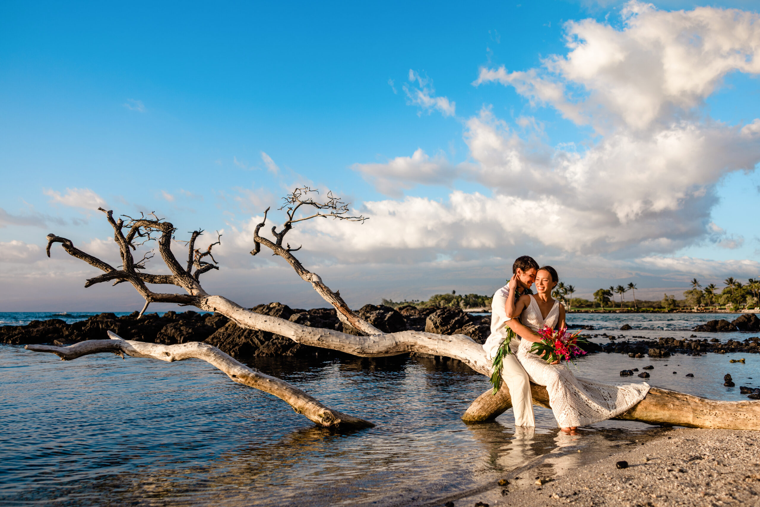 Couple on the beach after their Big Island elopement. Photo by Dawn Eicher.