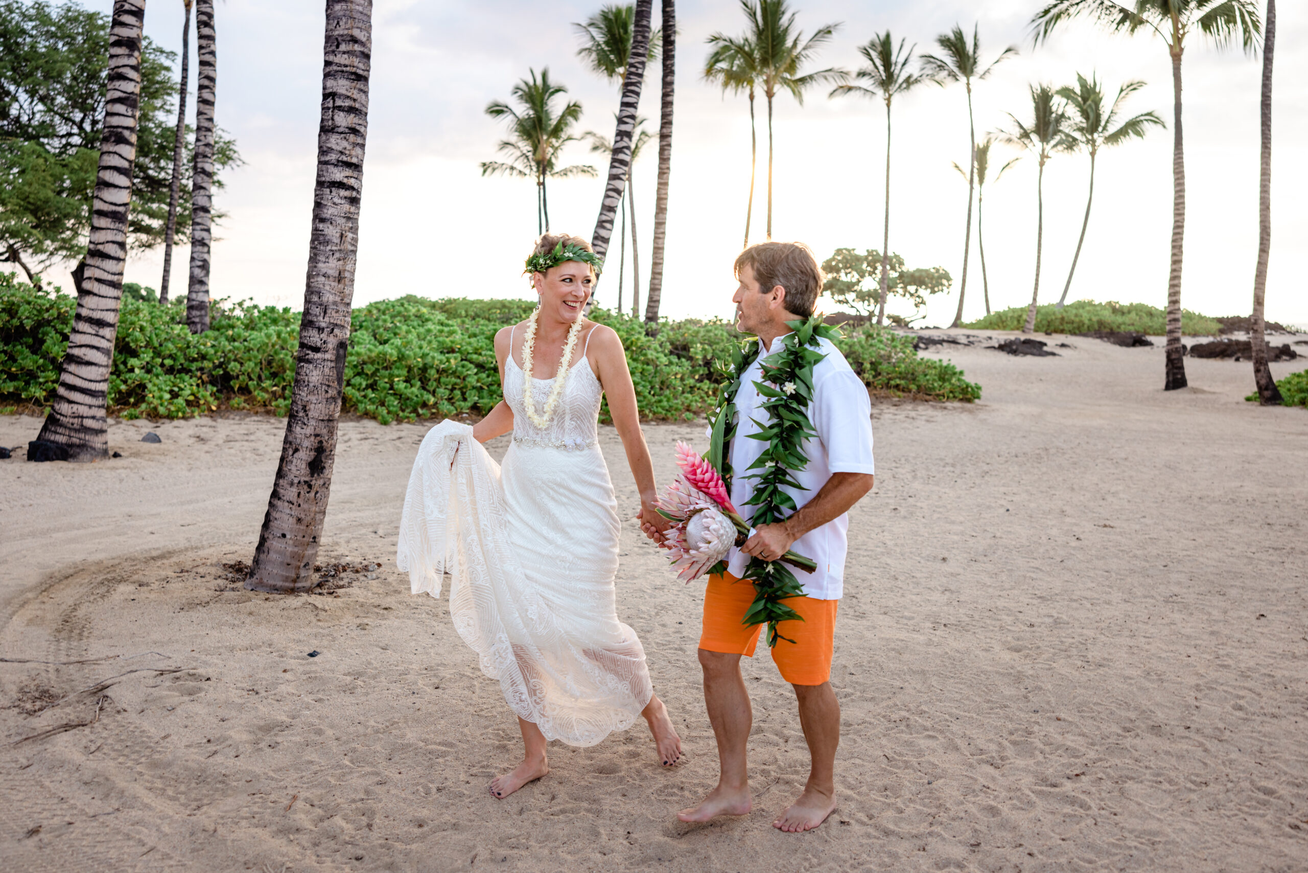 Couple on the beach after their Big Island elopement. Photo by Dawn Eicher