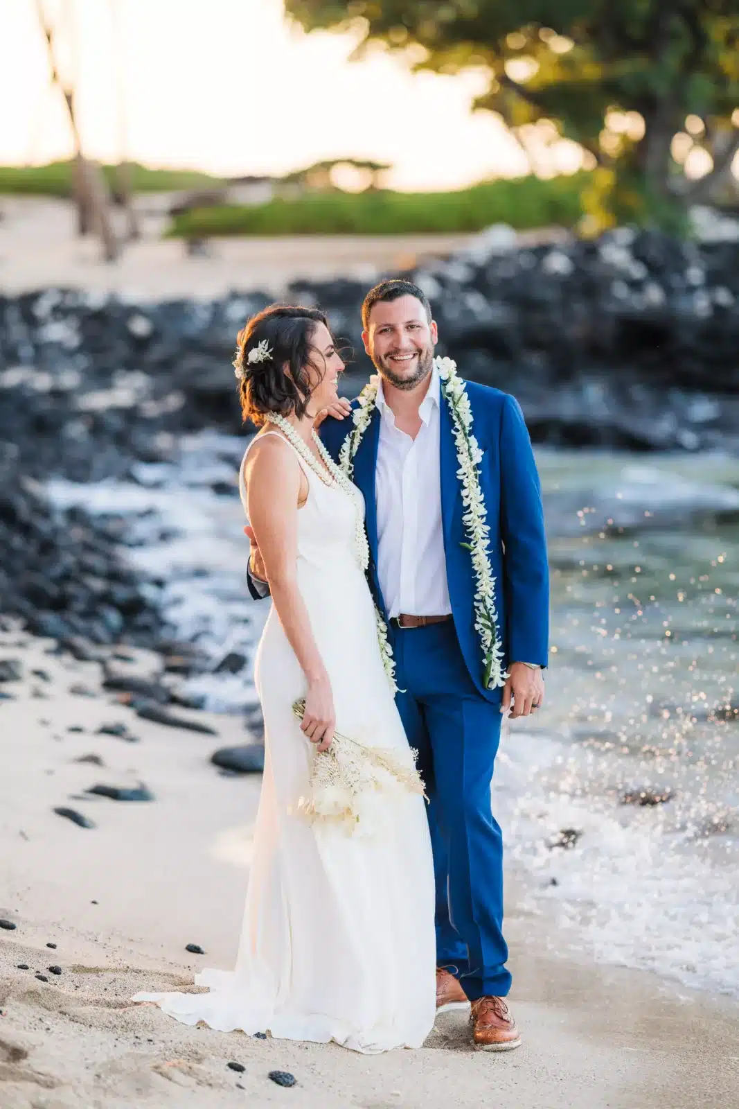 Couple on a beach in Hawaii after eloping on the Big Island
