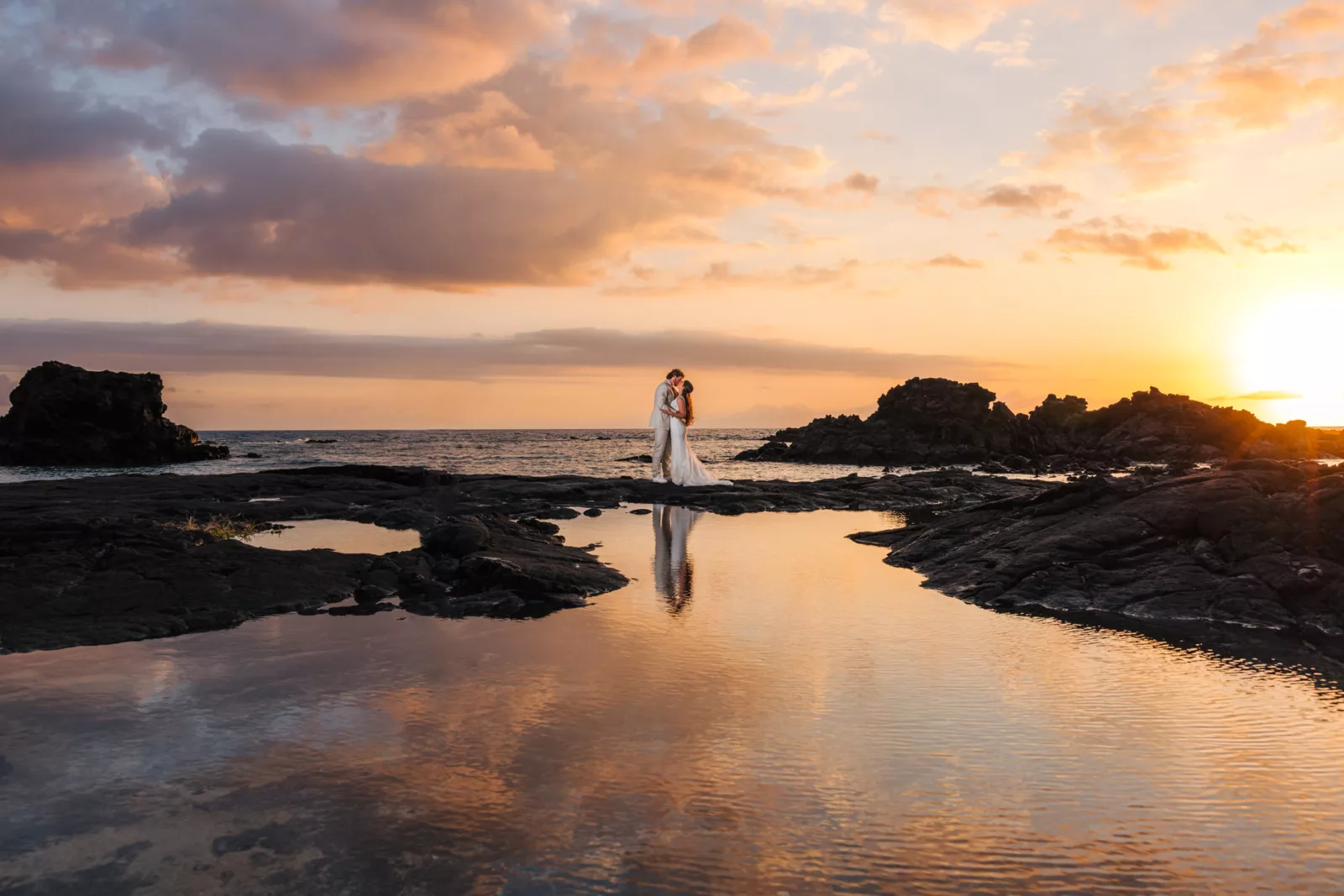 Epic sunset skies and beautiful water after a Big Island elopement