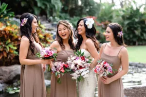 Bridesmaids by waterfall before the Big Island wedding in Hawaii